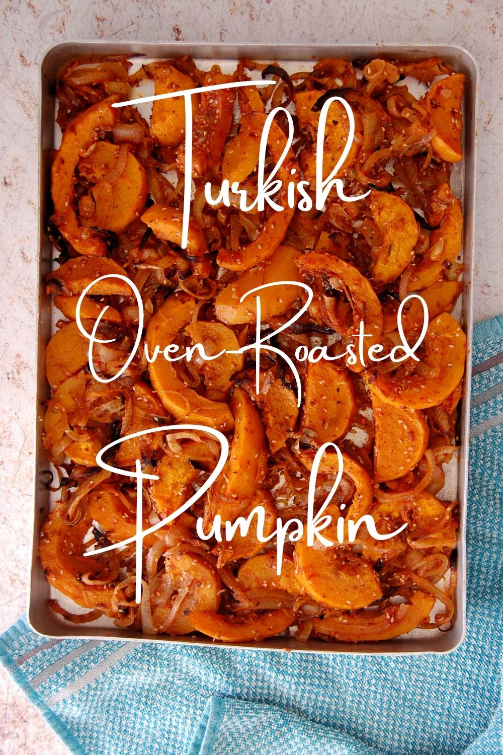“Pinable image for Sinkonta recipe. Tray off roast pumpkin and onions cooked. Text overy lay reads: Turkish Oven Roasted Pumpkin. 