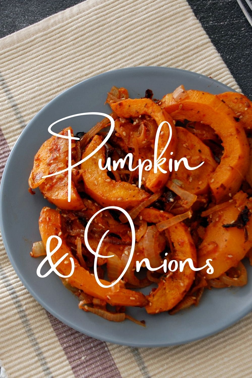 “Pinable image for Sinkonta recipe. Plate of served Turiskish style roast pumpkin and onions. Text overy lay reads: Pumpkin and onions. Exploirng The Turkish Kitchen.