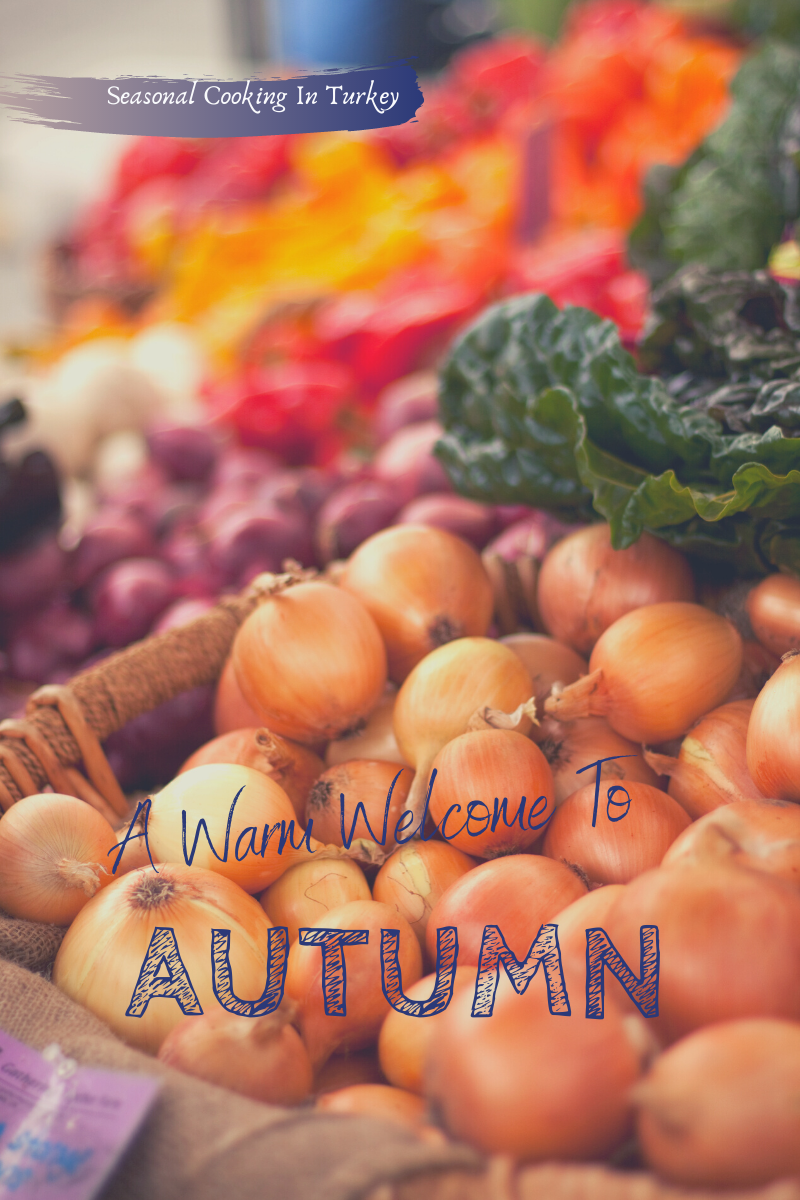 Blog banner. Picture of an autumn market scene. Text overlay reads: Seasonal Eating In Turkey. A Warm Welcome To Autumn